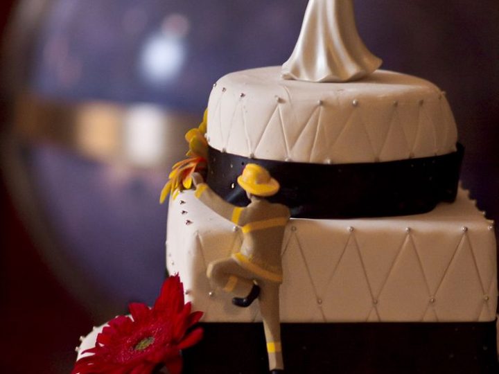 Image for Firefighter climbing to his Bride Cake